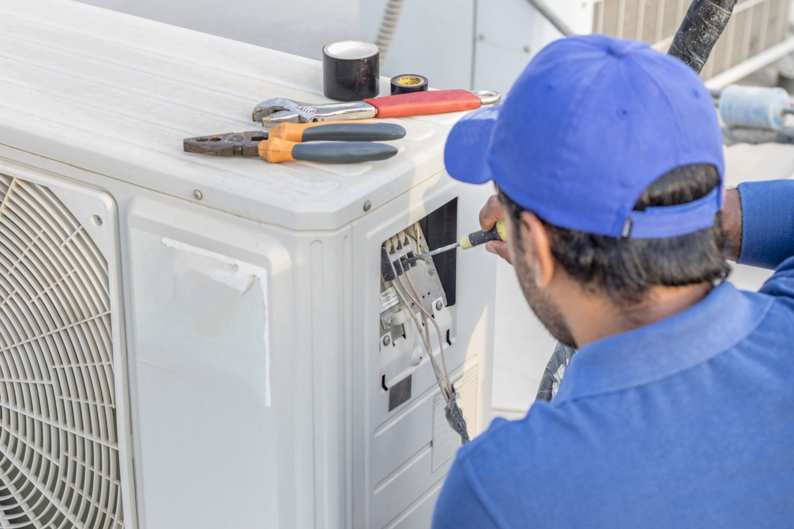 Skilled specialist handling an air conditioning replacement on an outdoor cooling system in Bridgewater, NJ